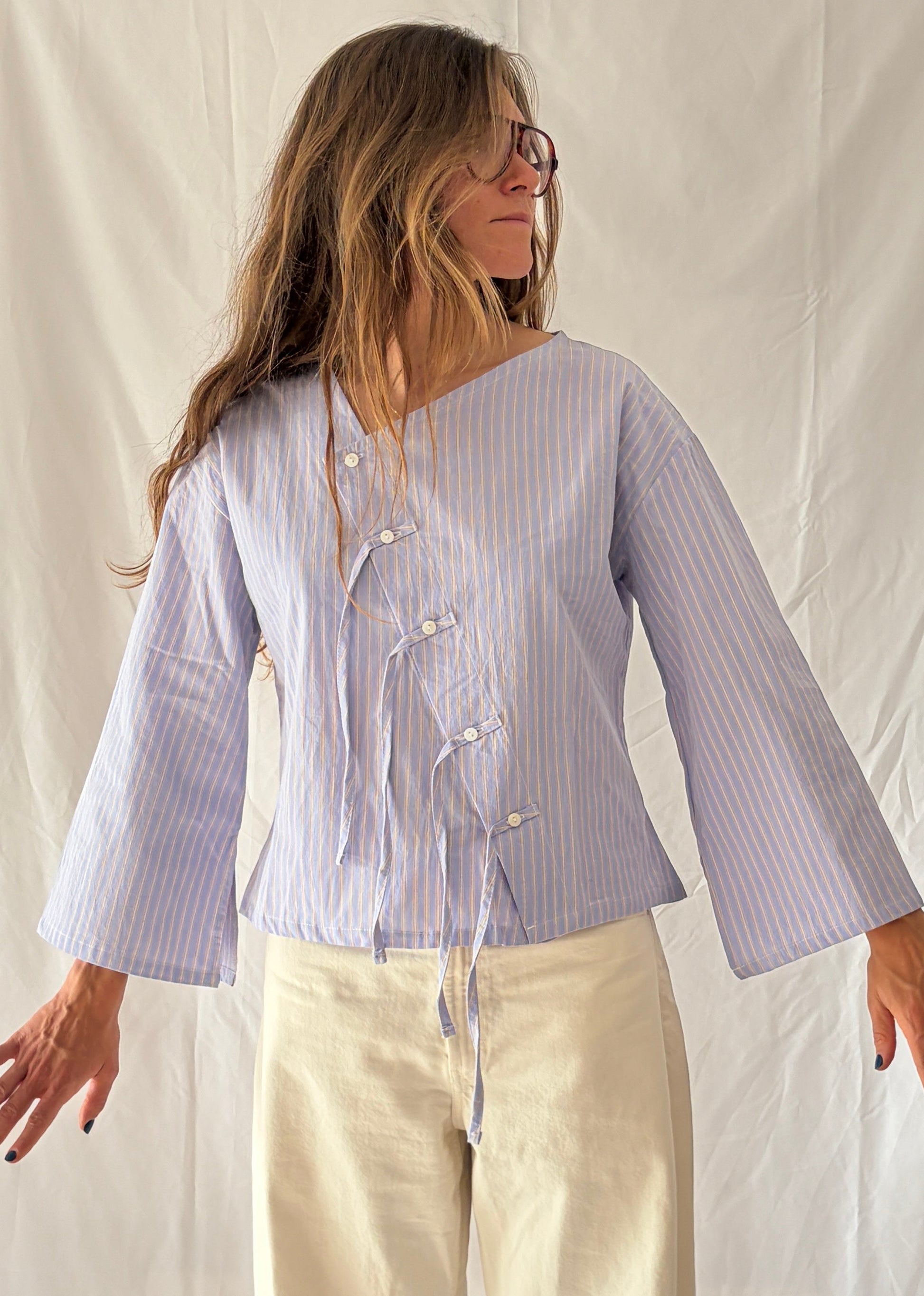 blusa asimétrica con flecos Magnolia de algodón orgánico nollen.